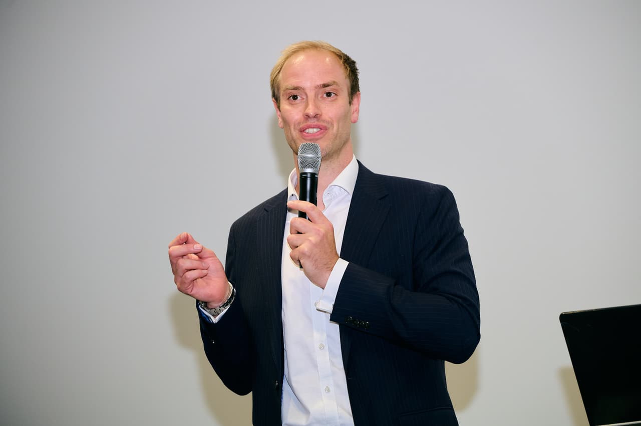 Harrison Talbot-Brown, MoD Deputy Director of Industry Collaboration & Strategic Supplier Management speaking at DSEI UK 2025.